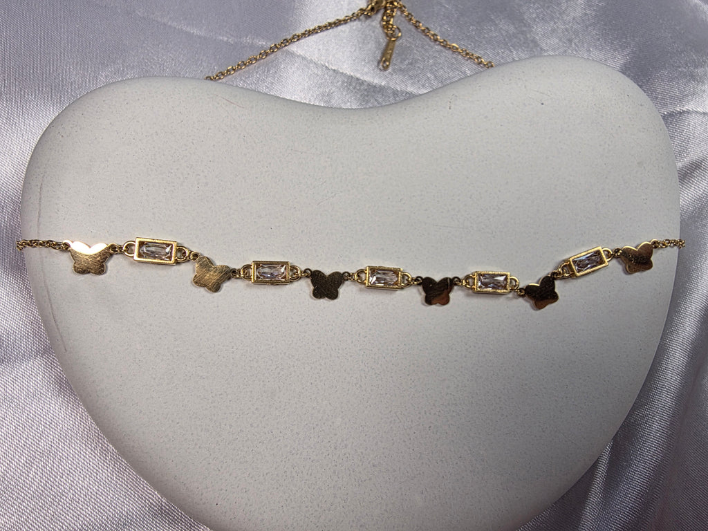 Butterfly and bezel set necklace