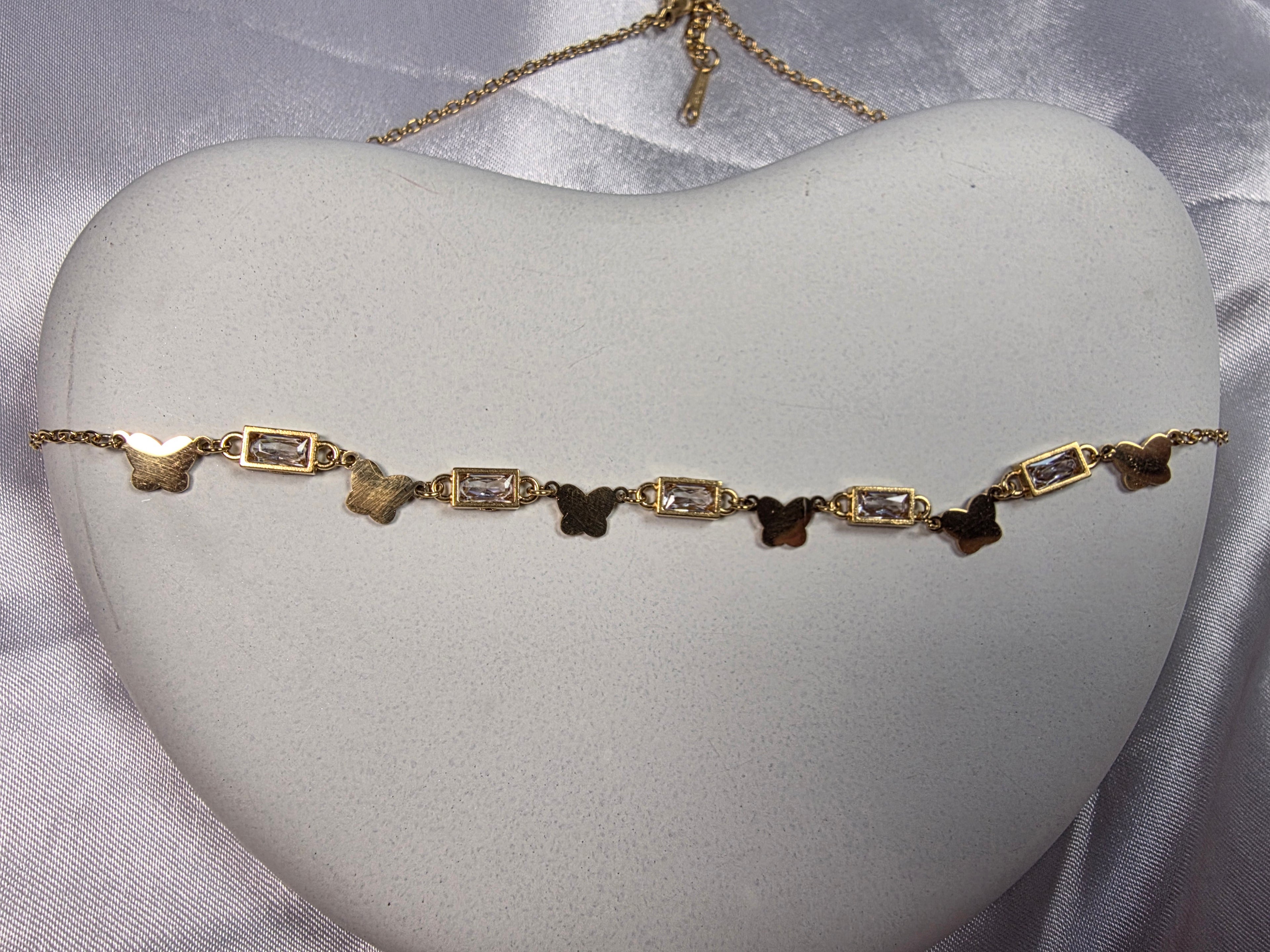 Butterfly and bezel set necklace