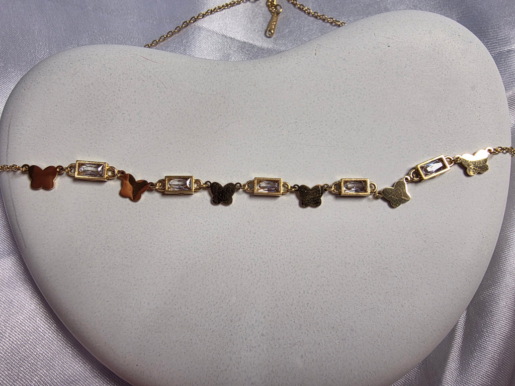 Butterfly and bezel set necklace