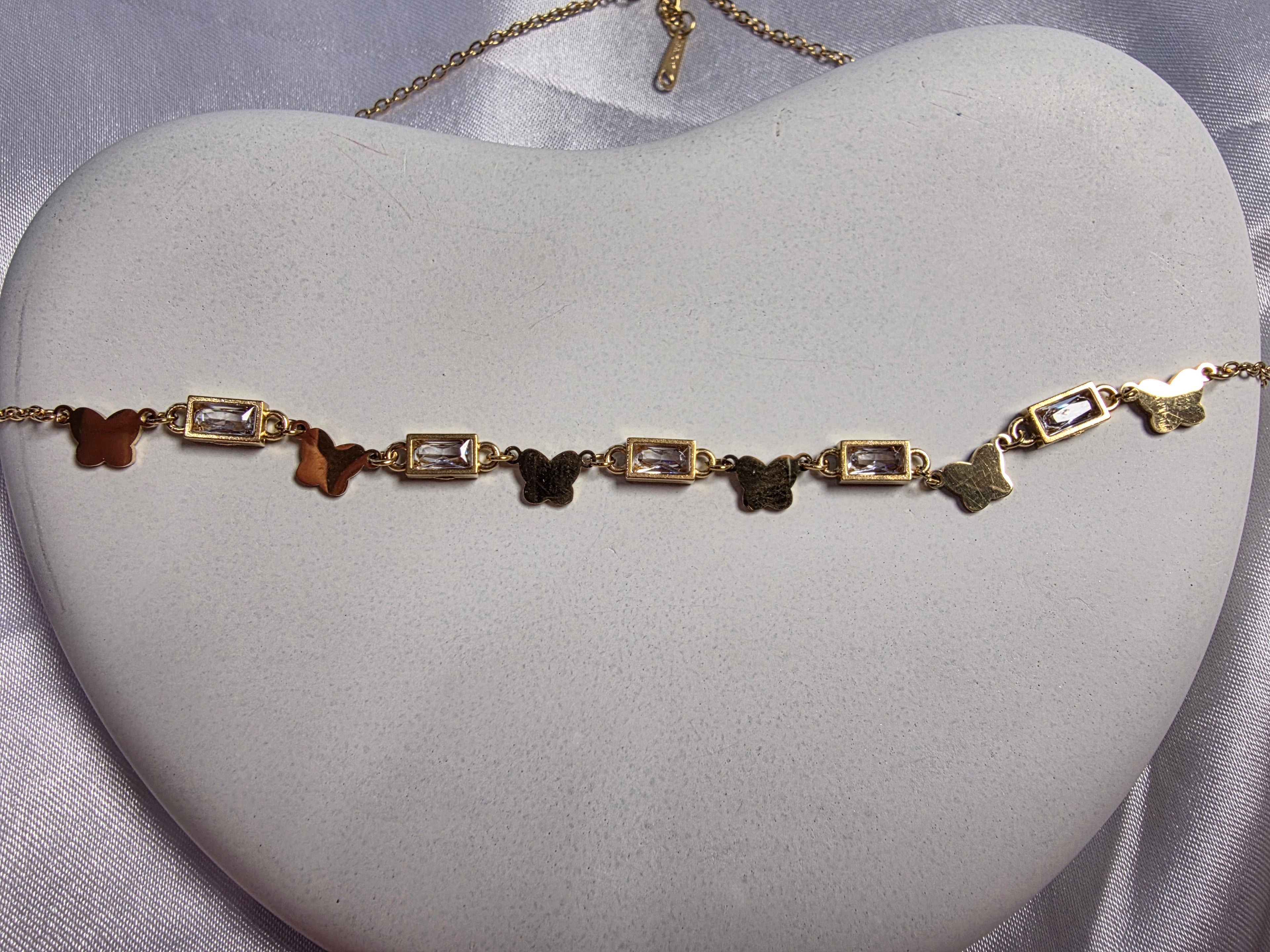 Butterfly and bezel set necklace